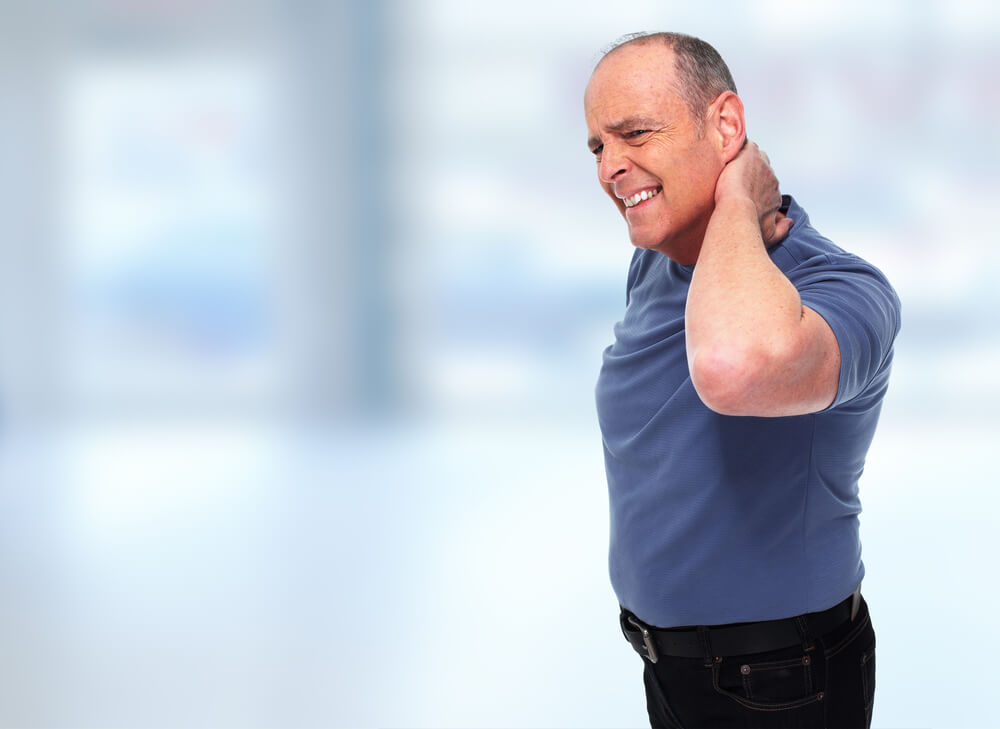 Man holding sore neck