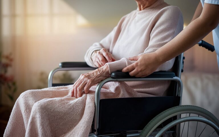 Home Health aide with patient in a wheelchair